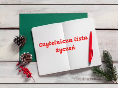 Na zdjęciu znajduje się otwarty notatnik na którym leży czerwony długopis. Całość znajduje się na stole z białych desek.